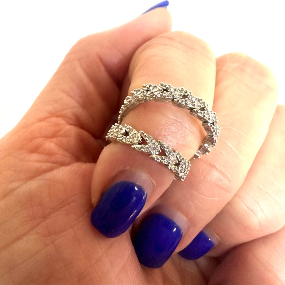Trendy adjustable silver knuckle ring.  NWOT.